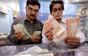 As US freezes aid, Pakistan dismisses economic fears