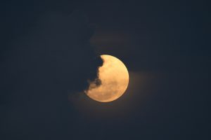 Gasps and awe as supermoon rises over erupting Philippine volcano