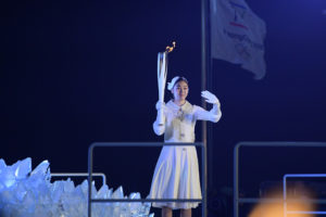 South Korea's champion figure skater Kim lights Olympic flame