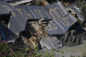 Eight dead, three missing after China road collapse