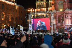 Putin cruises to landslide election win