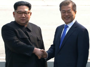 North's Kim and South's Moon shake hands over demarcation line: TV