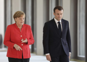 Macron, Merkel differ on fiscal policy in EU reform push Macron, Merkel differ on fiscal policy in EU reform push