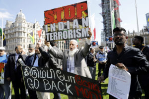 Modi faces protests as he signs &pound;1bn deal on UK trip
