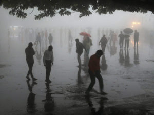 At least 125 killed as storms batter India