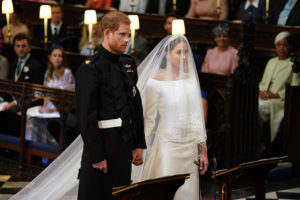 Harry and Meghan hold hands at emotional wedding service