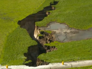 Biggest ever sinkhole tears across New Zealand farm