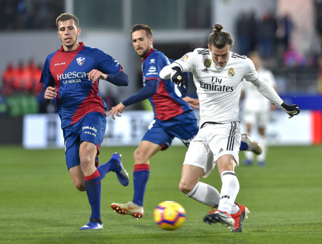 Bale snaps drought as Real edge past struggling Huesca Bale snaps drought as Real edge past struggling Huesca
